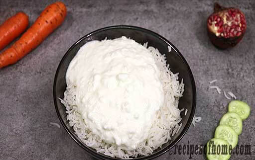 pour curd on top of cooked rice