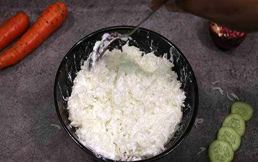 mix curd rice with a spoon