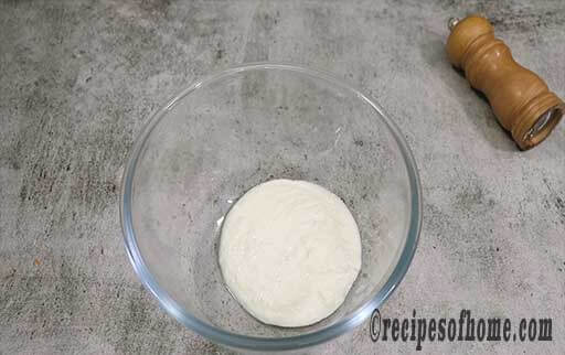 whisk thick curd in bowl
