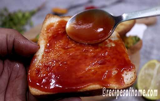 apply tomato ketchup on another bread slice