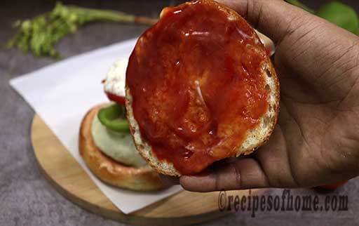 apply tomato ketcup on burger bun