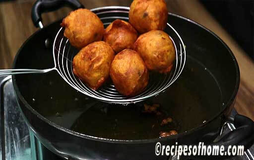 take out crispy batata vada from hot oil and serve immediately