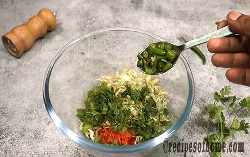 add cabbage, capsicum , carrots , coriander leaves , green chili in a mixing bowl