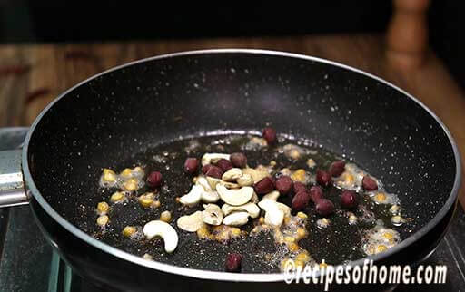 add cashew nuts, pea nuts in a pan