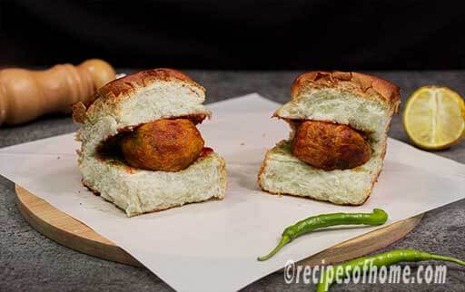 place hot crispy batata vada inside pav