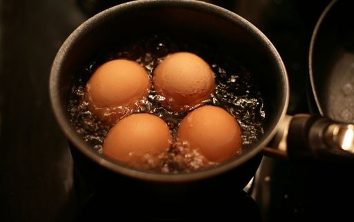 Add vinegar to water while boiling eggs to make peeling easier
