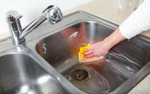 Clean the sink with dish soap